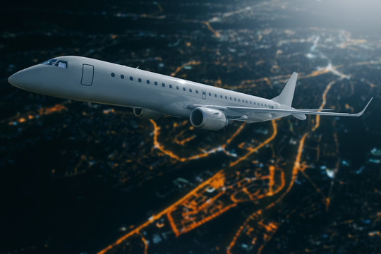 Passenger Airplane Flying Over City At Moon Night