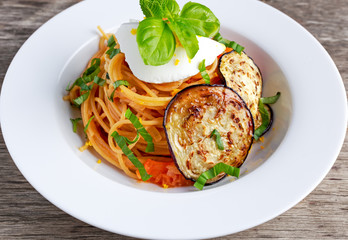 Italian Pasta with eggplants, tomato, ricotta cheese and basil