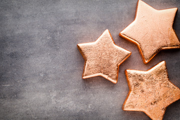 Bronze star. Christmas pattern. Background on the gray color.