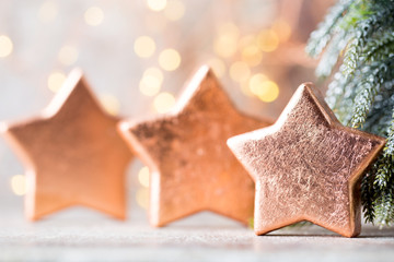 Christmas bronze decoration. Holiday decorations bronze on bokeh