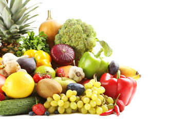 Ripe and tasty fruits and vegetables on a white background
