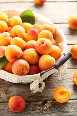 Ripe apricots fruit on grey wooden table