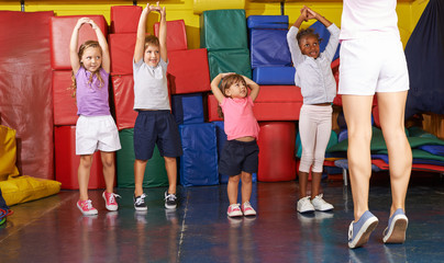 Kids gymnastics with children in physical education