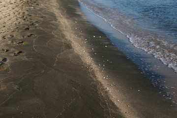 Black sand mud baths meets the sea sand