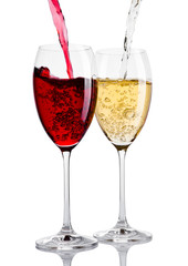 Glass of red and white wine pouring from bottle
