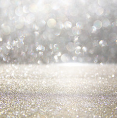 glitter vintage lights background. silver and white