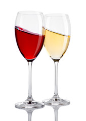Glass of red and white wine in motion on white