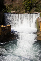 Artificial waterfall on river Psyrtsha in Abkhazia New Athos
