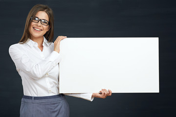 business woman holding white board show teeth with smile.