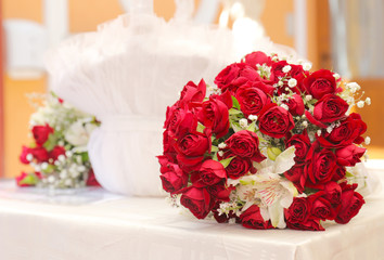 beautiful wedding bouquet of bright red flowers on table