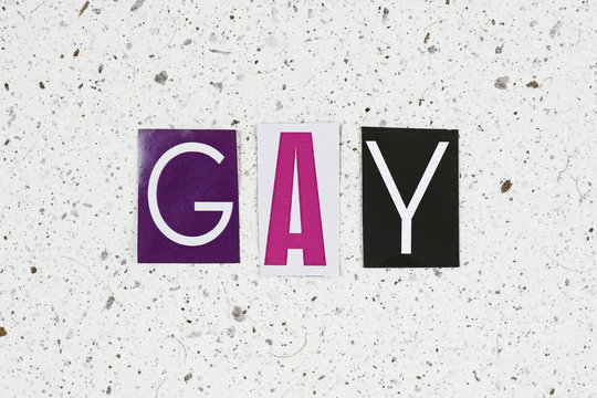 gay word on handmade paper texture