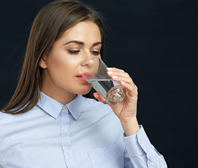 Face portrait of business woman drinking water