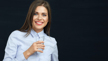 Smiling business woman holding water glass.