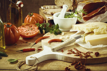 Delicious cheese, bread, meat, tomatoes and oil
