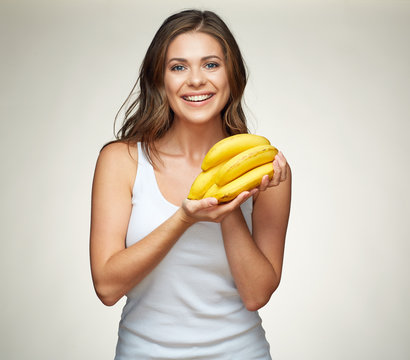 Toothy smiling woman hold bananas.