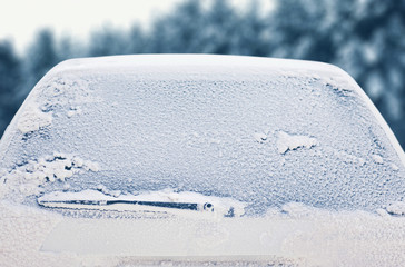 Winter frozen back car window, texture freezing ice glass backgr