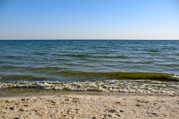 Cloudless sky, sea, sand beach