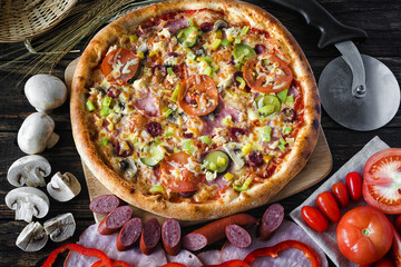 pizza and components lie side by side on the board