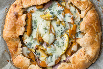 savoury tart with onion, pumpkin,apples and blue cheese