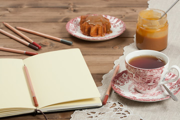 Open Notepad. Homebaked Cake, Maple Leaf Shape. Cup Of Tea. Toff