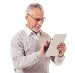 Mature businessman with gadget