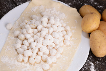 Goodies potatoes with raw potatoes on plate