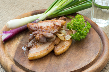 Fried streak of lean (fatback) served with vodka