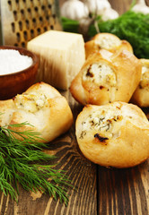 Baked buns stuffed with cheese and herbs
