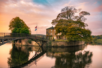 Naklejka premium Walton Hall in a scenic setting of rolling parkland with its own