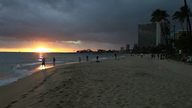 Beautiful sunset at Waikiki beach in Oahu. Waikiki beach, South Shore, is neighborhood of Honolulu and the most popular beach of Hawai.