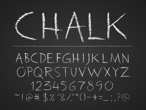 Uppercase letters, numbers and symbols hand drawn on chalkboard