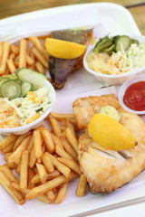 fried fish with lemon on top