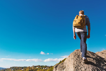 Man walking on the edge of a cliff