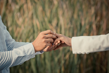 Man wearing wedding rings to lovers.