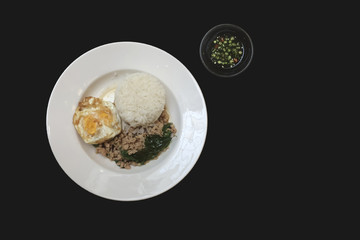 Rice topped with Fried Stir Basil , Minced pork and egg isolated