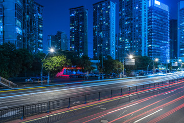 urban traffic road with cityscape at night in China.