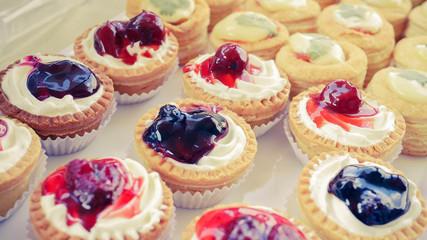 Delicious blueberry, strawberry and other cakes set for wedding