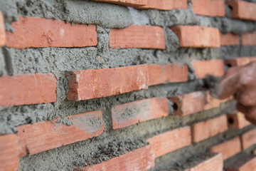 Construction mason worker with trowel and cement mortar