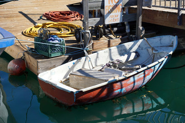 small fishing boat docked in harbor