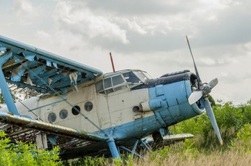 Old russian biplane aircraft An-2 at an abandoned