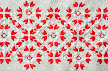Ukrainian embroidery folk pattern ornament. Design of ethnic textures. Embroidered element by red and white threads.