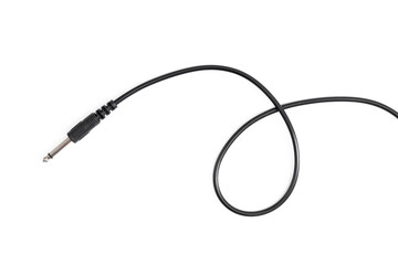 Guitar audio jack with black cable isolated on white background.