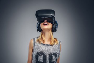 A woman wearing virtual reality glasses.