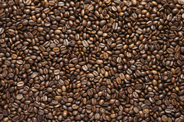 Roasted coffee beans closeup, top view