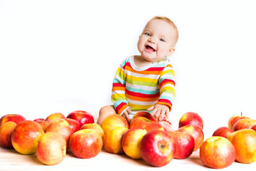 Fototapeta premium Happy baby with apple isolated on white