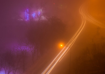 Aerial View of Light Trails on a Foggy Night