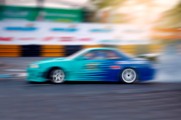 Obraz na płótnie Canvas Race car racing on speed track with motion blur