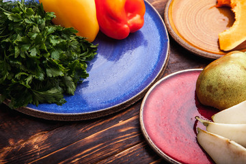 Sliced pears on a ceramic plate on the background of old boards