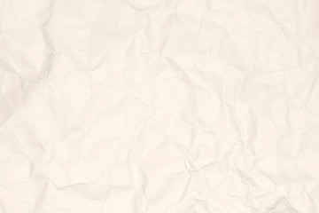 Crumpled light brown paper texture or paper background for design with copy space for text or image.
