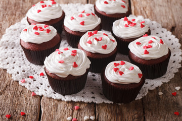 tasty red velvet cupcakes close-up on the table. Horizontal